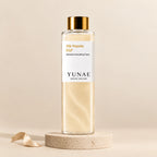 Yunae Silk Peptide EGF Toner: clear bottle with a glossy gold cap and shimmering champagne-gold toner