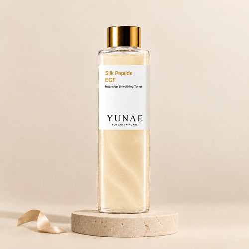 Yunae Silk Peptide EGF Toner: clear bottle with a glossy gold cap and shimmering champagne-gold toner